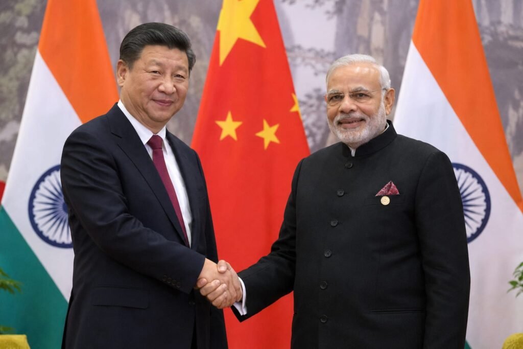 Xi Jinping hand shakes PM Modi