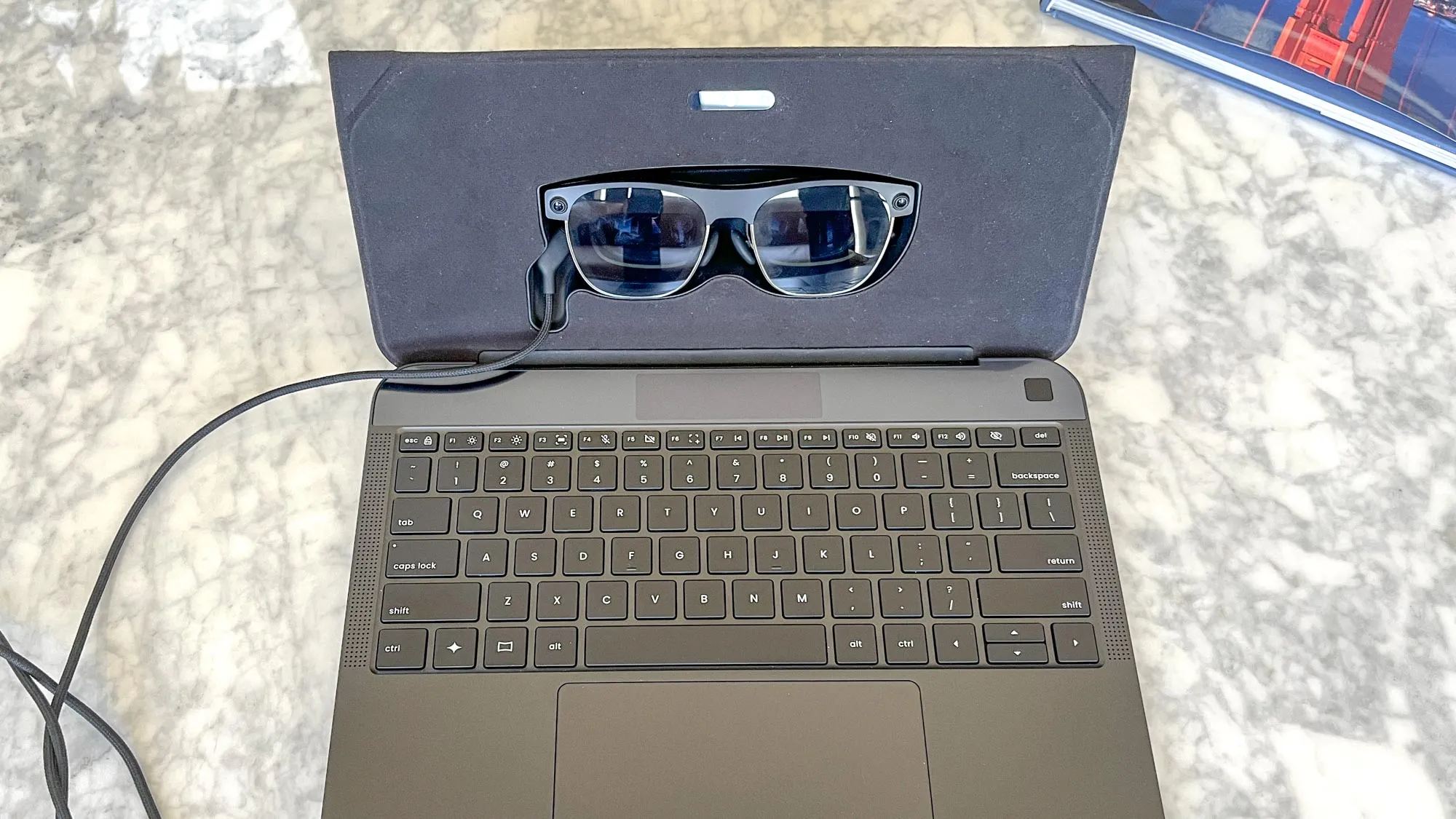 Screenless Laptop Creates a 100-Inch Virtual Workspace Using AR Glasses